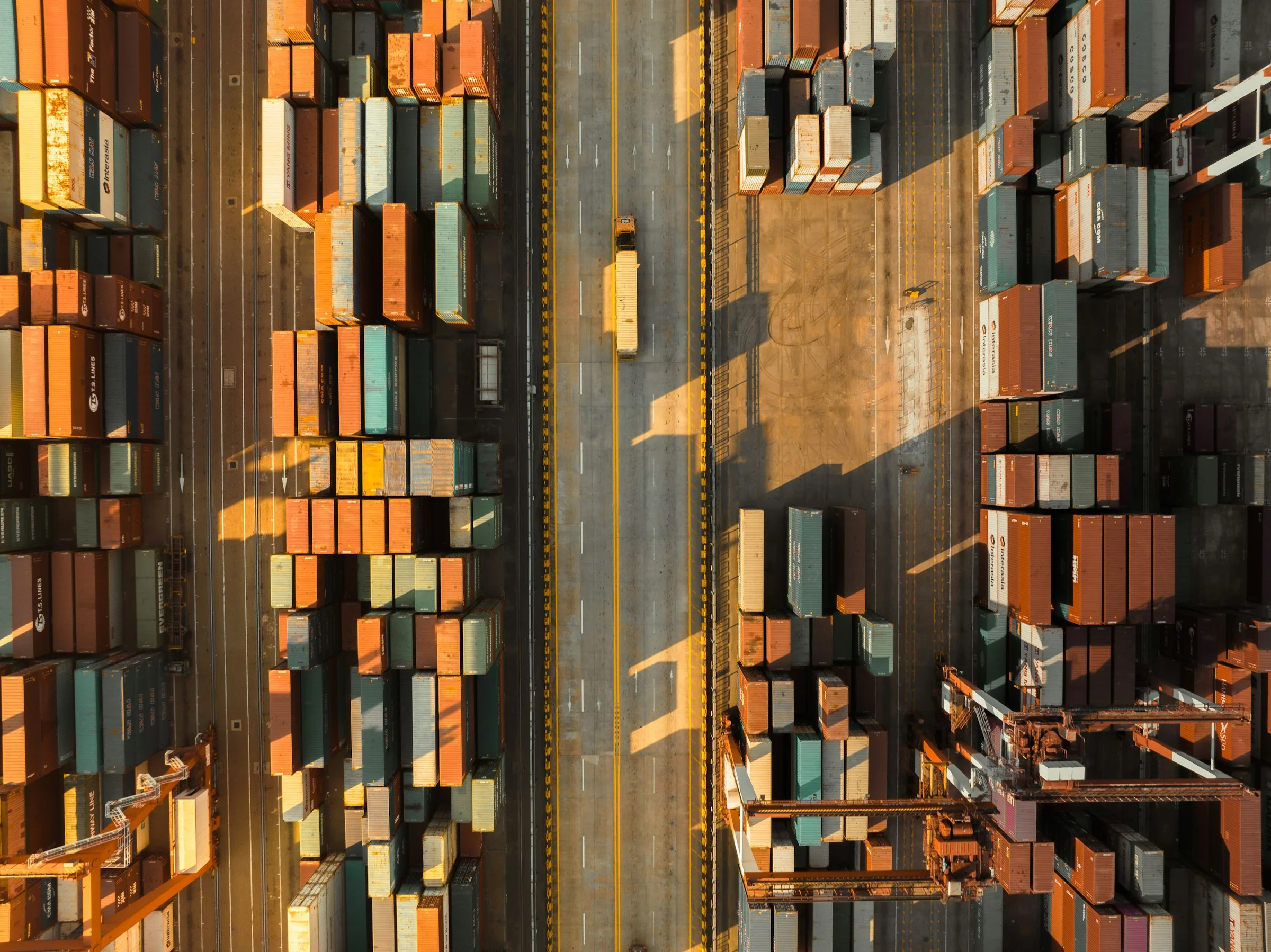 Aerial view of a container terminal with stacked shipping containers